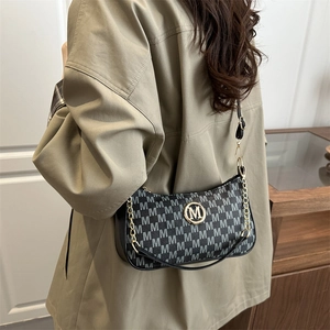 Fashionable black and white jacquard shoulder bag with golden M logo and chain strap
