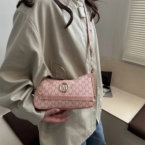 Pink monogram shoulder bag with metallic M logo and chain strap for stylish women
