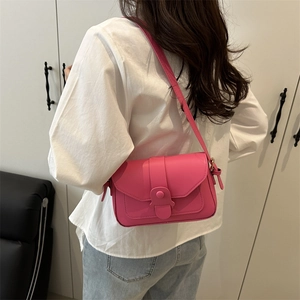 Fashionable magenta leather rectangular crossbody bag with foldover flap and strap buckle