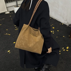 Brown woven strap tote bag for women featuring a minimalist design for autumn fashion