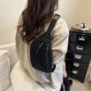 Chic black leopard print crossbody chest bag with double zipper and adjustable strap