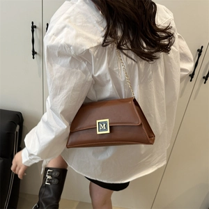 Brown vintage faux leather crossbody bag with golden M metal buckle and chain strap