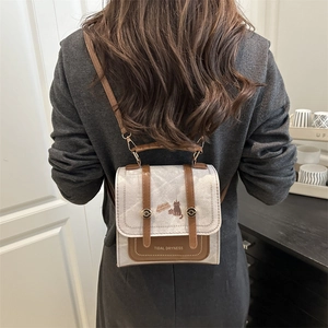 Chic retro square backpack for women featuring cat illustration and brown leather trim