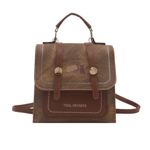 Vintage brown leather mini backpack with cat illustration and top handle for women