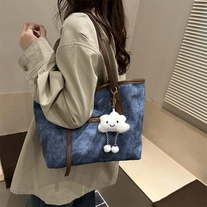 Retro washed denim tote bag for women with brown leather trim and white cloud charm
