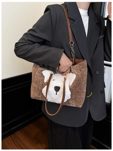 Brown corduroy tote bag with cartoon dog patch shown with metal chain strap