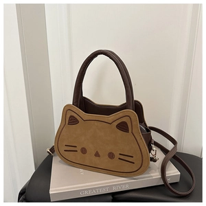 Close-up of cat-shaped crossbody bag with contrast colors and cat face embroidery details