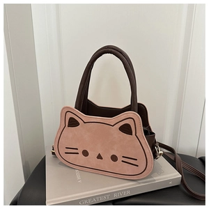Close-up of cat-shaped crossbody bag with pink suede texture and embroidery details