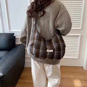 Retro brown and blue plaid canvas tote bag for women shown as a casual shoulder bag