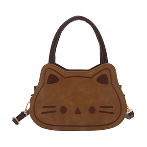 Brown cat-shaped crossbody handbag with embroidered face and gold-tone hardware on white background