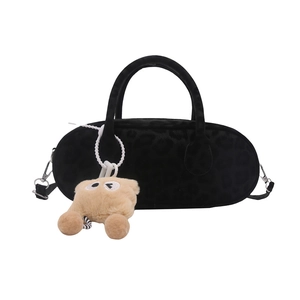 Black plush leopard print pillow bag with twin handles and detachable shoulder strap
