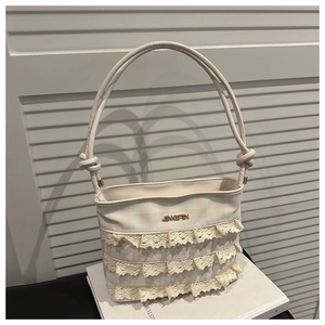 Detail of cream white lace ruffle handbag with checkered canvas and JINGPIN logo