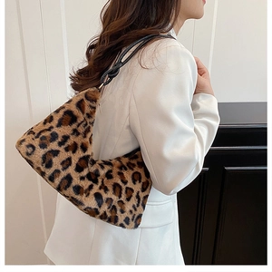 Detail of plush leopard print faux fur hobo bag with unique knotted black shoulder strap