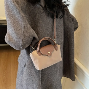 Retro khaki nylon crossbody bag with brown leather flap and stylish gold hardware