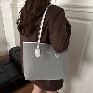Chic grey leopard print tote bag with FASHION text and sleek silver shoulder straps