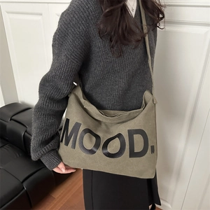 Army green canvas crossbody bag with MOOD lettering for casual everyday styling