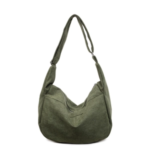 Minimalist large dark green hobo bag with adjustable wide shoulder strap on white background