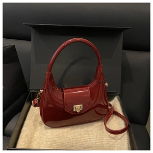 Red patent leather Hobo bag with gold buckle in premium gift box packaging