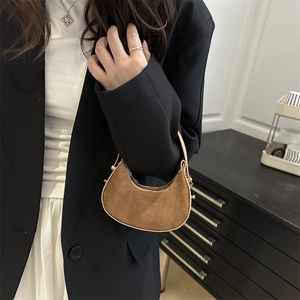 Brown suede crescent handbag with light piping and metal clasp for winter women's fashion