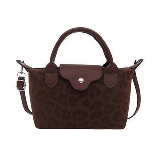 Chic dark brown leopard print mini top handle bag with crossbody strap and silver hardware