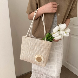 Fashionable straw woven tote bag with sunflower detail and white rope handles