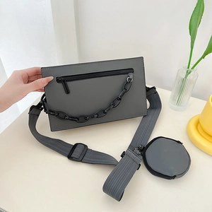 Modern dark grey PU crossbody bag with black chain detail and mini round coin purse
