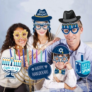 Family wearing Hanukkah party photo booth props with Menorah and Star of David