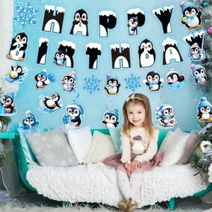 Blue penguin themed happy birthday banner and snowflake hanging swirl decorations