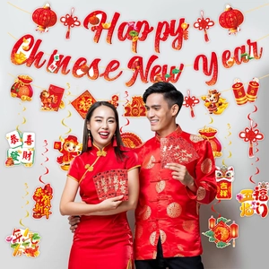 Detailed view of Lunar New Year party set with Happy Chinese New Year banner and red envelopes