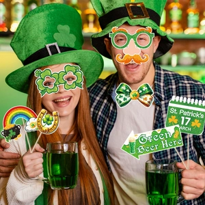 St. Patrick's Day photo booth props set featuring green shamrock glasses and festive signs