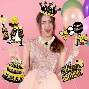 Detailed set of 18th birthday photo booth props with black and gold glitter paper designs