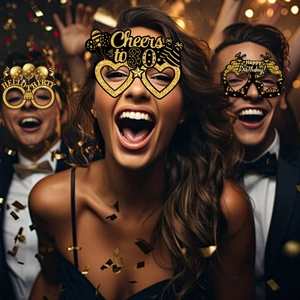 Detail of 30th birthday party glasses with gold glitter frames and festive holiday text