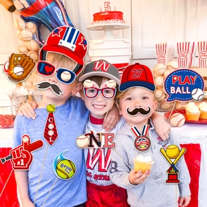 Kids celebrating with baseball theme party photo props like hats, glasses and signs