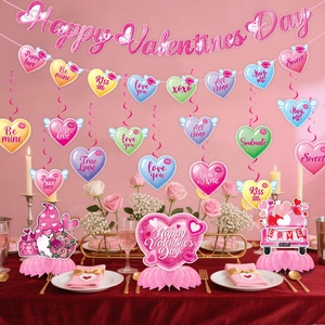 Detailed view of Valentine's Day party set with heart banners and honeycomb centerpieces