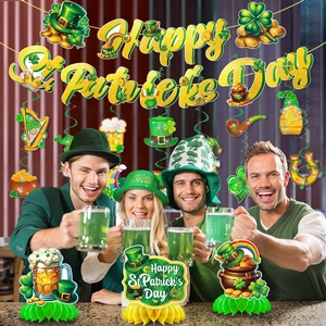 Detailed St. Patrick's Day party set with shamrock banner and honeycomb centerpieces