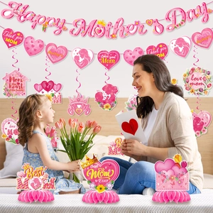Detail of Happy Mother's Day party set with pink banner spirals and honeycomb table decor