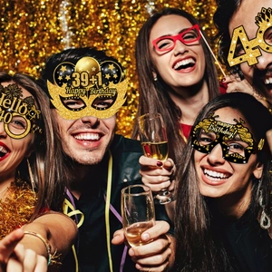 Cheerful group wearing 40th birthday party glasses with gold glitter and champagne glasses