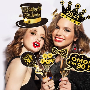 Women celebrating 30th birthday with black and gold glitter handheld photo booth props