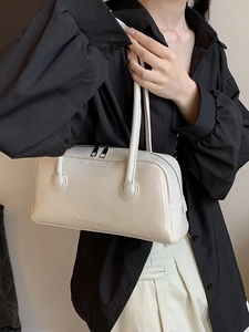 Chic white matte leather baguette bag with top handles and logo embossing