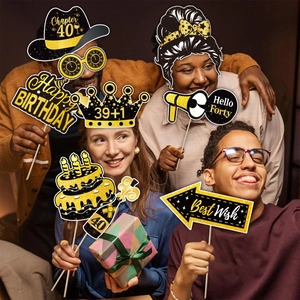 40th Birthday black and gold photo booth props with Chapter 40 and Hello Forty signs