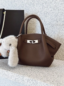 Brown litchi grain bucket bag with silver buckle and plush rabbit keychain charm