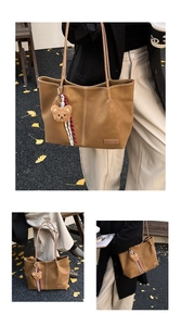 Detail of retro brown tote bag with plush bear charm on autumn ginkgo leaf background
