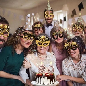 80th birthday party accessory set with glitter glasses, sash, cake topper and candles