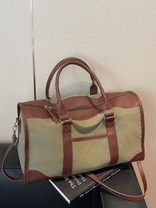 Retro canvas travel bag with leather accents and top handles for gym or short trips