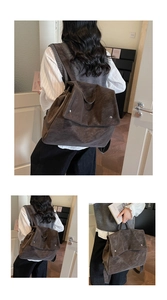 Detail view of large dark brown faux suede backpack with flap and vintage texture