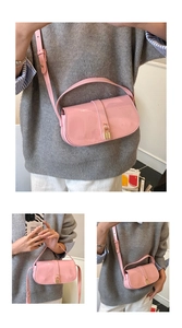 Detail of pink patent leather handbag featuring a golden lock and adjustable strap