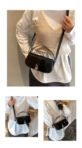 Detailed views of a black patent leather square bag with a gold lock and adjustable strap