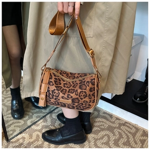 Detail of leopard print boston bag with adjustable wide strap and polished metal zipper