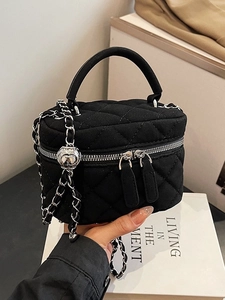 Mini suede quilted chain bag in black with elegant silver heart adjuster and top handle