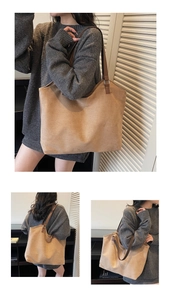 Macro view of the camel suede tote bag texture and reinforced slim shoulder strap